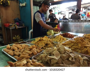 SKUDAI,JOHOR-FEBRUARY 4 2018:Malay Hawker At His Stall Selling Traditional Cookies To Customers