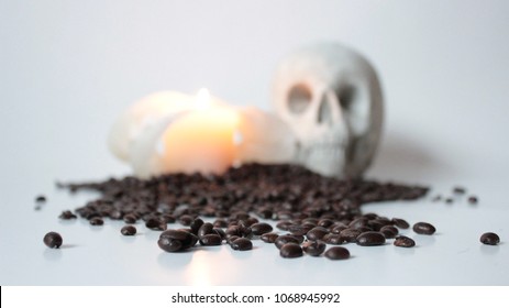 Skull coffee beans and candle, focus on front - Powered by Shutterstock