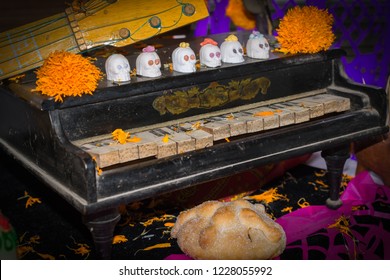 The skull heads are on the old piano.