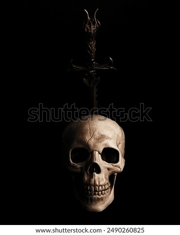 Skull pierced with a dagger or sword, gothic pirate dark light.