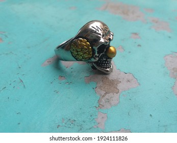 skull ring that is manly and strong and this concept illustrates the power of this silver ring - Powered by Shutterstock