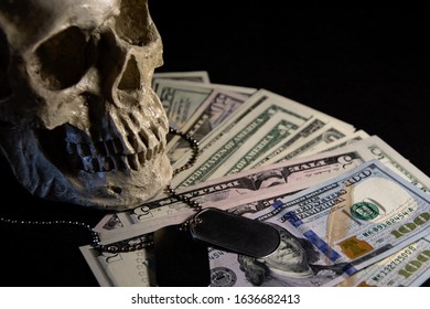 Skull with soldiers ' medallions on the background of American dollars. Concept: dead American soldiers, the price of victory, loss of breadwinner in the family, monetary compensation from the state. - Shutterstock ID 1636682413