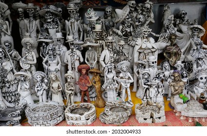 Skulls, Some Representing Our Lady Of The Holy Death Or Santa Muerte, A Mexican Deity, Are Seen For Sell In A Street Stall Of Chapultepec Public Park, Mexico City, Mexico.