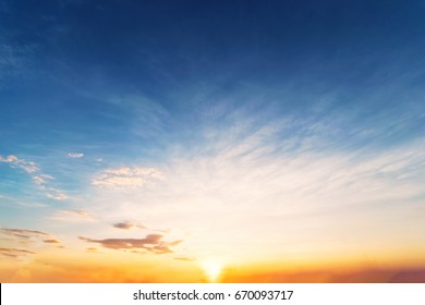 Sky Background At Sunset,Sky Blue And Orange Light Of The Sun Through The Clouds In The Sky Survive