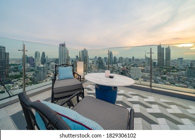 Sky Bar, A Restaurant Or Cafe Lounge Terrace With Dinner Table On Rooftop Of Hotel, High Rise Architecture Building With City View In Bangkok Downtown Skyline, Urban City, Thailand.