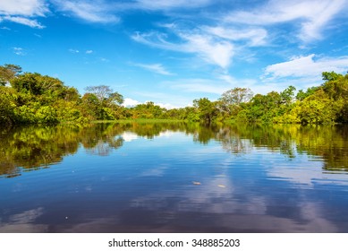 Sky Being Reflected In The Javari River In The Amazon Rain Forest