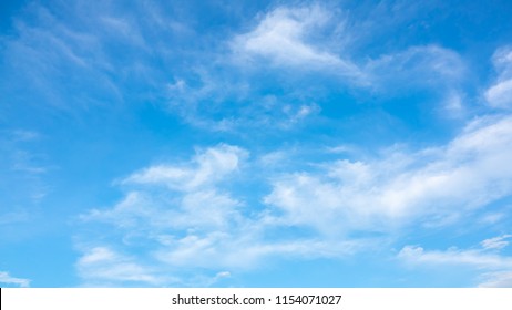 Sky Blue Or Azure Sky And Clouds Is Bright White Background. Everything Lies Above Surface Atmosphere Outer Space Is Sky. Cloud Is Aerosol Comprising Visible Mass Of Liquid Droplets Frozen In Air.