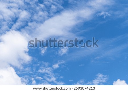 Sky is blue and clear with no clouds. The sky is very bright and the sun is shining. Blue sky with scattered white clouds creating a serene and peaceful atmosphere. Ideal for backgrounds, nature theme