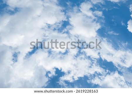 Sky is blue and clear with no clouds. The sky is very bright and the sun is shining. Blue sky with scattered white clouds creating a serene and peaceful atmosphere. Ideal for backgrounds, nature theme