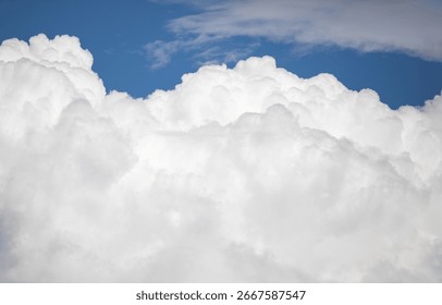 The sky is blue and cloudy. The clouds are white and fluffy