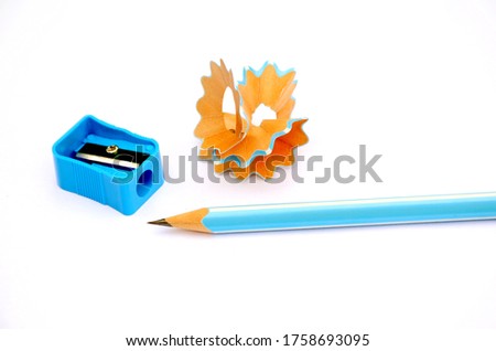 the sky blue colour pencil with sharpner and these waste background on the white