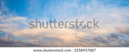 The sky is blue panorama with a few clouds. The clouds are white and scattered. The sky is clear and bright