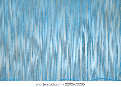 Sky blue yarn threads stretched on a loom abstract background. Turquois knitting yarn stings textured backdrop - Powered by Shutterstock