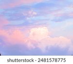 sky is clear in the evening before sunset. The clouds in the imaginary sky are blue and pink, gradually changing the intensity of blue from pink to light yellow, becoming a beautiful and charming 