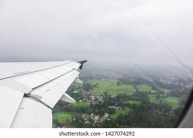 Sky and cloud as seen through window of an aircraft