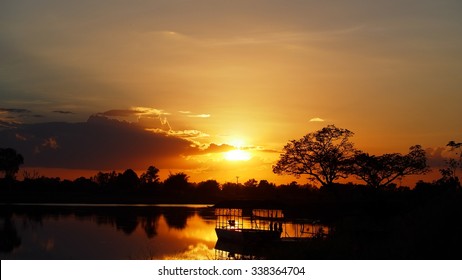 Sky And Cloud When Sunset In The Evening Of Winter With Big Trees Near Swamp: Silhouette Photo 