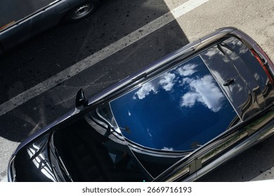 Sky and Clouds Reflected on Car Roof. beautiful reflecting the blue sky. Sustainability and Environmental Conservation. climate change, renewable energy, eco friendly living, social responsibility.