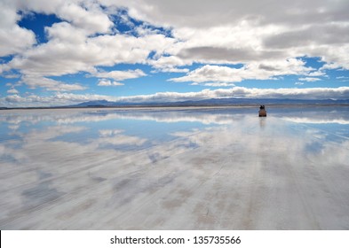 Sky with clouds and reflections in Salar de Uyuni, Bolivia