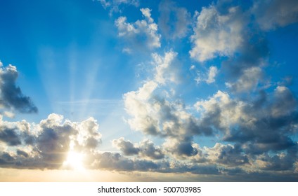 sky with clouds and sun