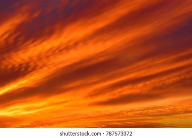 Sky with clouds in sunset time. Blurred background - sunset colors .