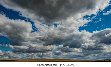 sky and cold rain clouds over the fields. Autumn season, October.