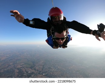 Sky Dive Tandem Friends At The Sunset.