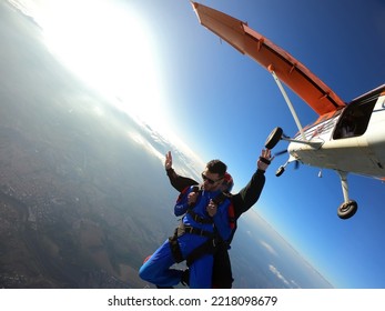 Sky Dive Tandem Friends At The Sunset.