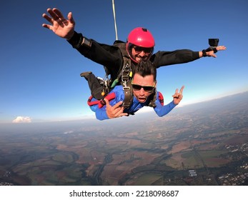 Sky Dive Tandem Friends At The Sunset.