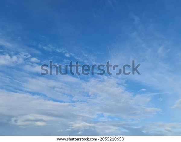 The sky is divided in\
half, the upper half is clear and beautiful. the lower half of the\
white cloud 