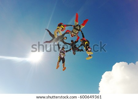 Sky diving group formation low angle view