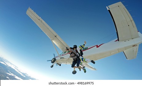 Sky Diving Tandem Friends Jump From The Plane