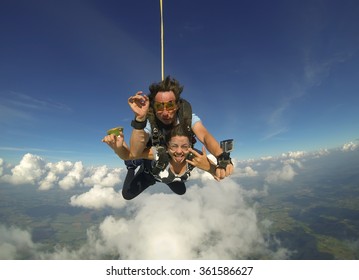 Sky Diving Tandem Happiness With Clouds