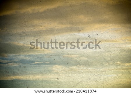 sky with dramatic clouds and sun light  on the wall texture