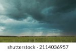 Sky During Rain Horizon Above Rural Wheat Landscape Field. Agricultural And Weather Forecast Concept. Storm, Thunder, thunderstorm, stormclouds, , , . Rainy Day, stormclouds Sky During Rain Horizon