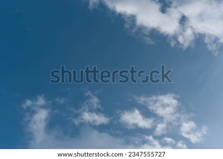 Sky in the evening during the rainy season. After the rain has stopped, there will be few clouds. The sky is clear. making the clouds appear bright white The sky surface is clearly blue.