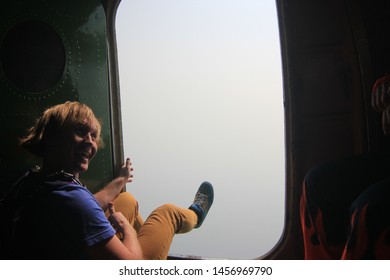 Sky Fashion. Skydiving And Open Door In Plane.Foot In Fast Wind.