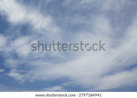 It is a sky with feathery clouds.