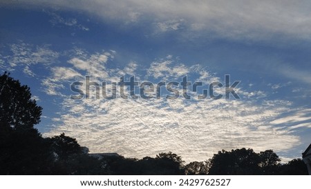 sky with fleecy cloud before sunset