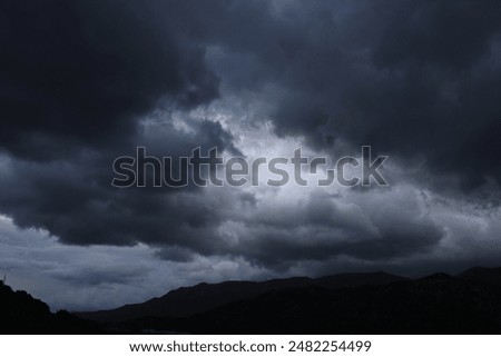 Sky full of dark clouds before the rain, storm before the change of weather, bad weather, autumn rain, high quality professional photography

