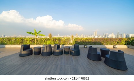 Sky garden on private rooftop of condominium or hotel, high rise architecture building with tree, grass field, and blue sky. - Shutterstock ID 2114498852