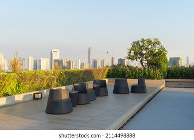 Sky garden on private rooftop of condominium or hotel, high rise architecture building with tree, grass field, and blue sky. - Shutterstock ID 2114498888