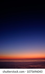 Sky Gradation To Dark Blue From Red Orange Sea Horizon