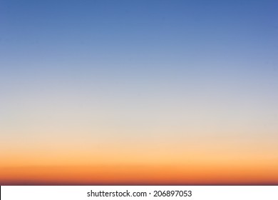 Sky Gradient From Blue To Orange Sunrise.