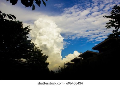 The Sky Have Beautiful Big Clouds.In The Shadow Of The House. And Trees Too.