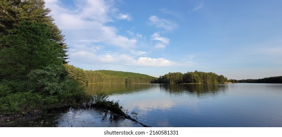 Sky, hills and trees reflected in the Quabbin Reservoir, Massachusetts - Shutterstock ID 2160581331
