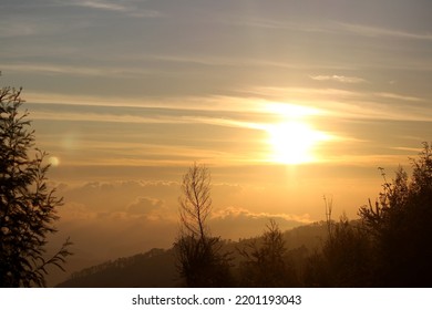 The Sky Is Illuminated By The Rising Sun Creating A Stunning Vista Of Nature