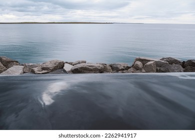 Sky Lagoon in Iceland. Geothermal spa with heated water on cold day - Powered by Shutterstock