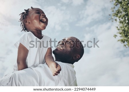 The sky is the limit. Shot of a young father and daughter spending time together outside.