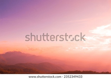 The sky, mountains, and clouds, when combined, create a harmonious natural beauty that allows one to feel the pure atmosphere. The sunlight piercing through the clouds making it incredibly beautiful.
