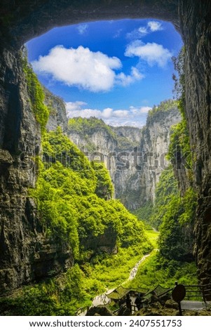 The sky is a natural opening in the roof of the rock pit. Lush green valleys. The Three Natural Bridges are a series of natural limestone bridges, Chongqing.